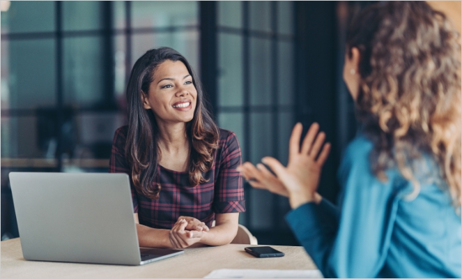 Two Real Estate Women Agent in Team Discussion